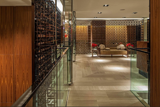 Commercial interior with precision-fabricated glass railings, demonstrating the importance of fabrication control in project execution.