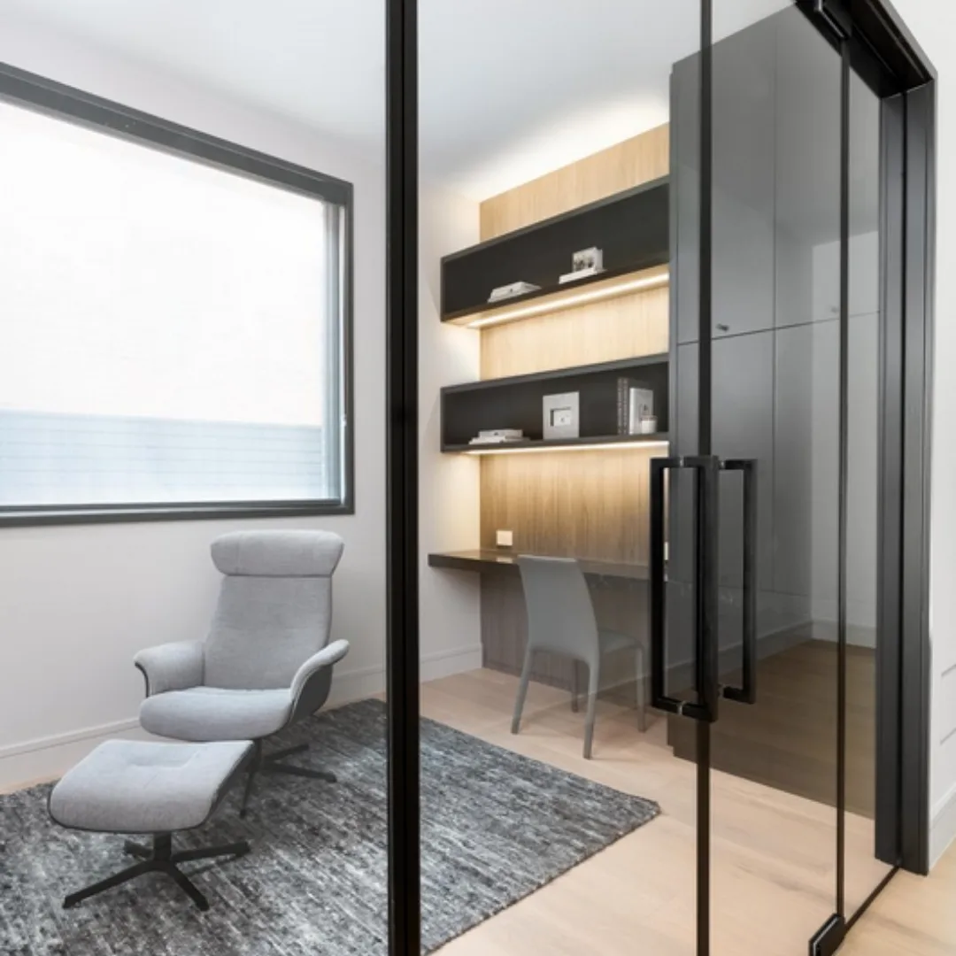 Tempered glass partition used in a modern interior workspace.